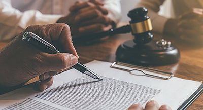 Signing a Document — Bay Area, CA — Law Offices of Mark R. Mittelman, P.C. Signing a Document — Bay Area, CA — Law Offices of Mark R. Mittelman, P.C.