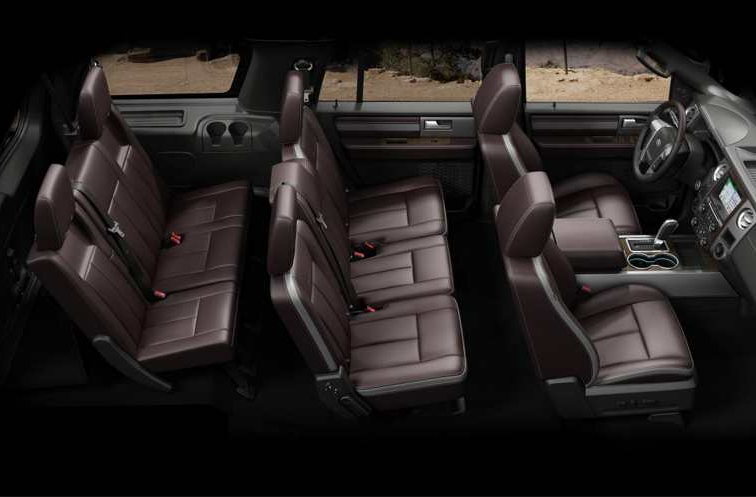Brown leather interior of a Ford Expedition, showcasing three rows of seating and the driver's area.