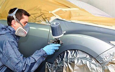 Mechanic Painting Cars Body - Auto Repair in Erie, Pennsylvania Mechanic Painting Cars Body - Auto Repair in Erie, Pennsylvania