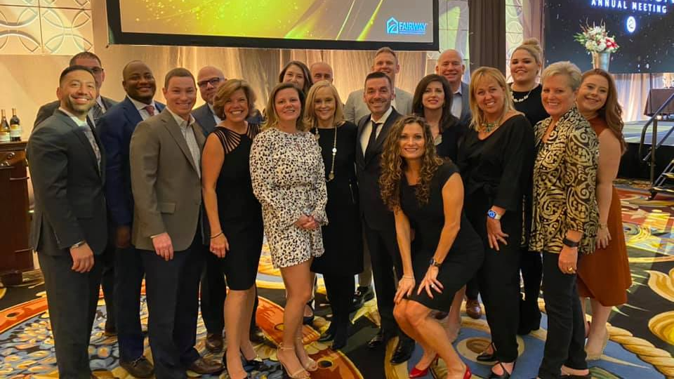 Fairway Mid-Atlantic Leadership Team poses for the camera to celebrate their accomplishments at an award ceremony