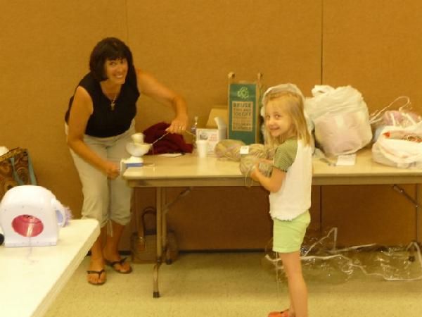Our 2nd youngest member, Midori (Karen's granddaughter), helps ball yarn with Barb S.