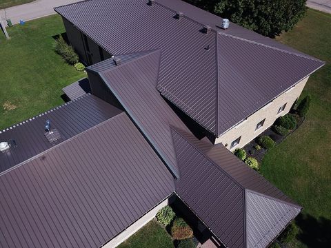 Birds eye view of black metal cross hipped roof