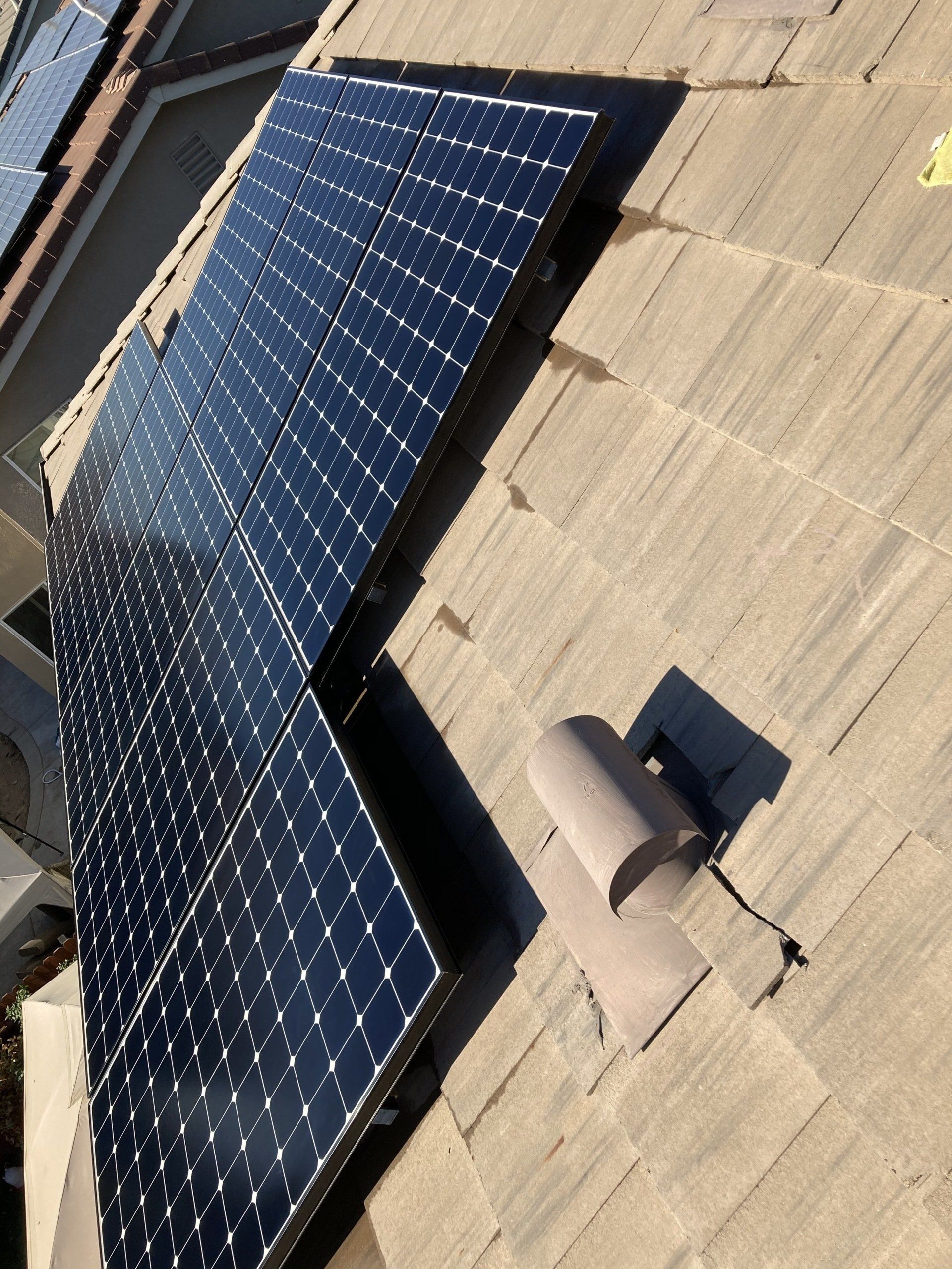 A roof with a lot of solar panels on it