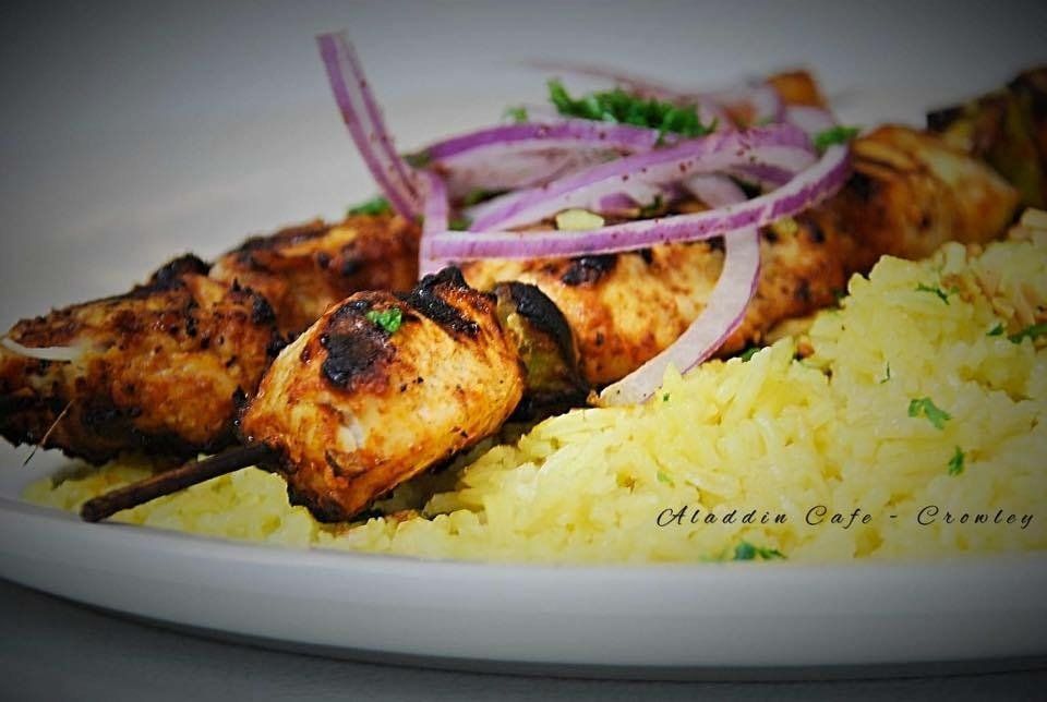 a close up of a plate of food that says aladdin cafe on it