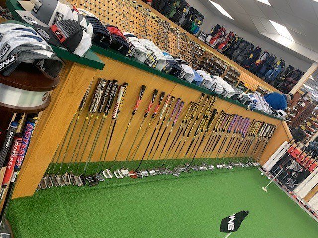 Dozens of Putters by Practice Green