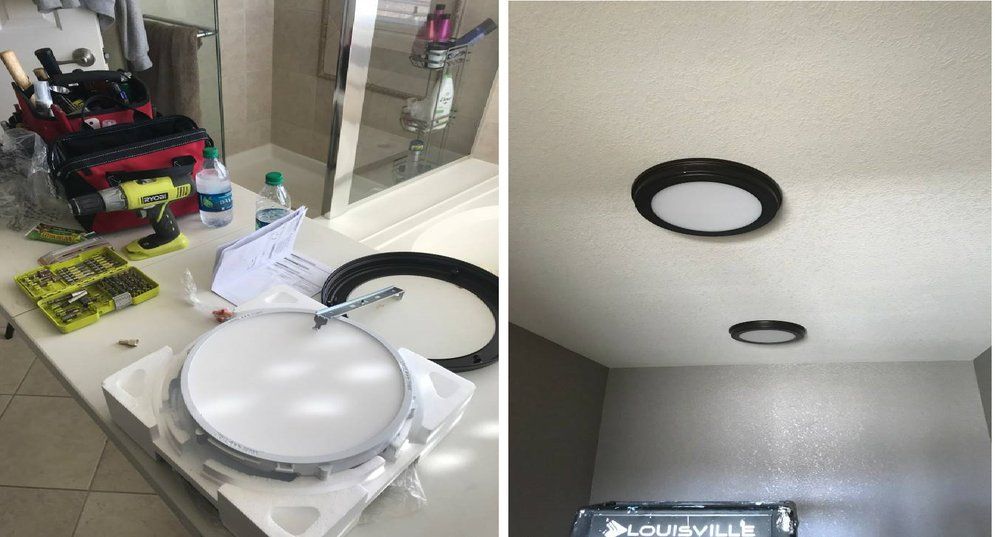 Bathroom ceiling with two installed LED lights, and installation tools on a counter with an open new light.
