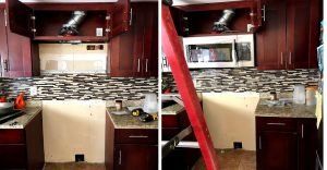 Kitchen renovation with upper cabinets, microwave, backsplash, and partial demolition.