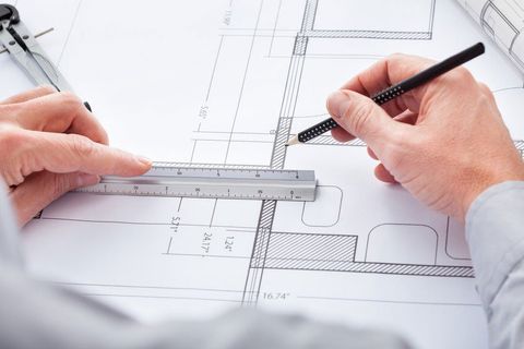 Close-up Of Person's Hand Drawing Plan On Blue Print; Shutterstock ID 170622563; PO: N/A; Job: BULK; Client: N/A; Other: BULK