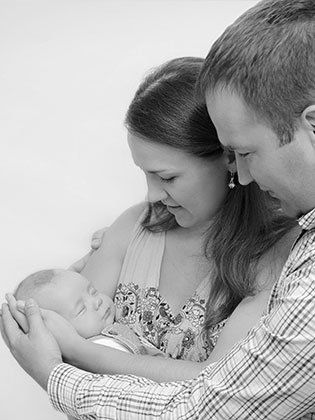 Couple cuddling a baby - Law Firm in Denver, CO