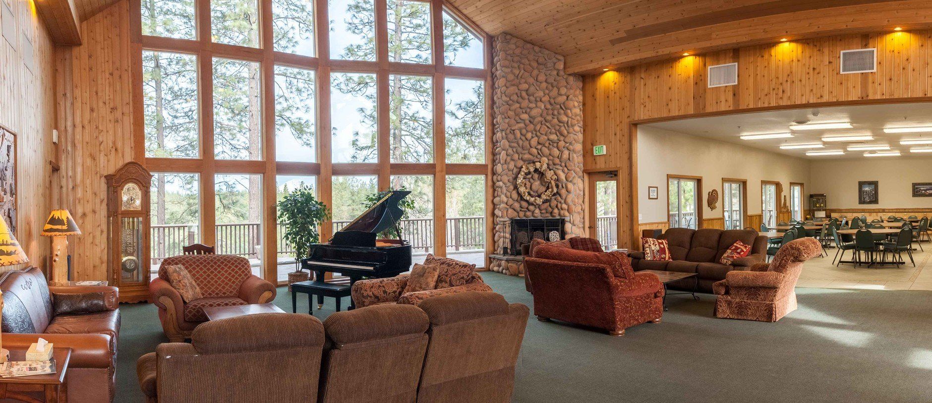 A living room with lots of furniture and a piano