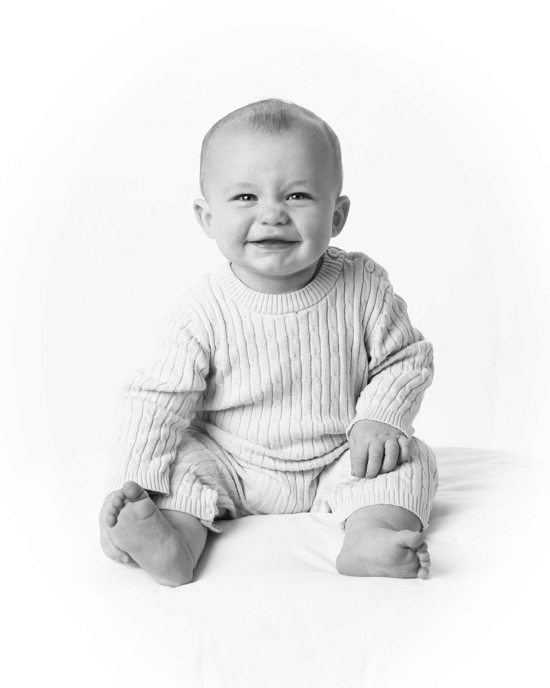 Adorable black and white photo of laughing baby
