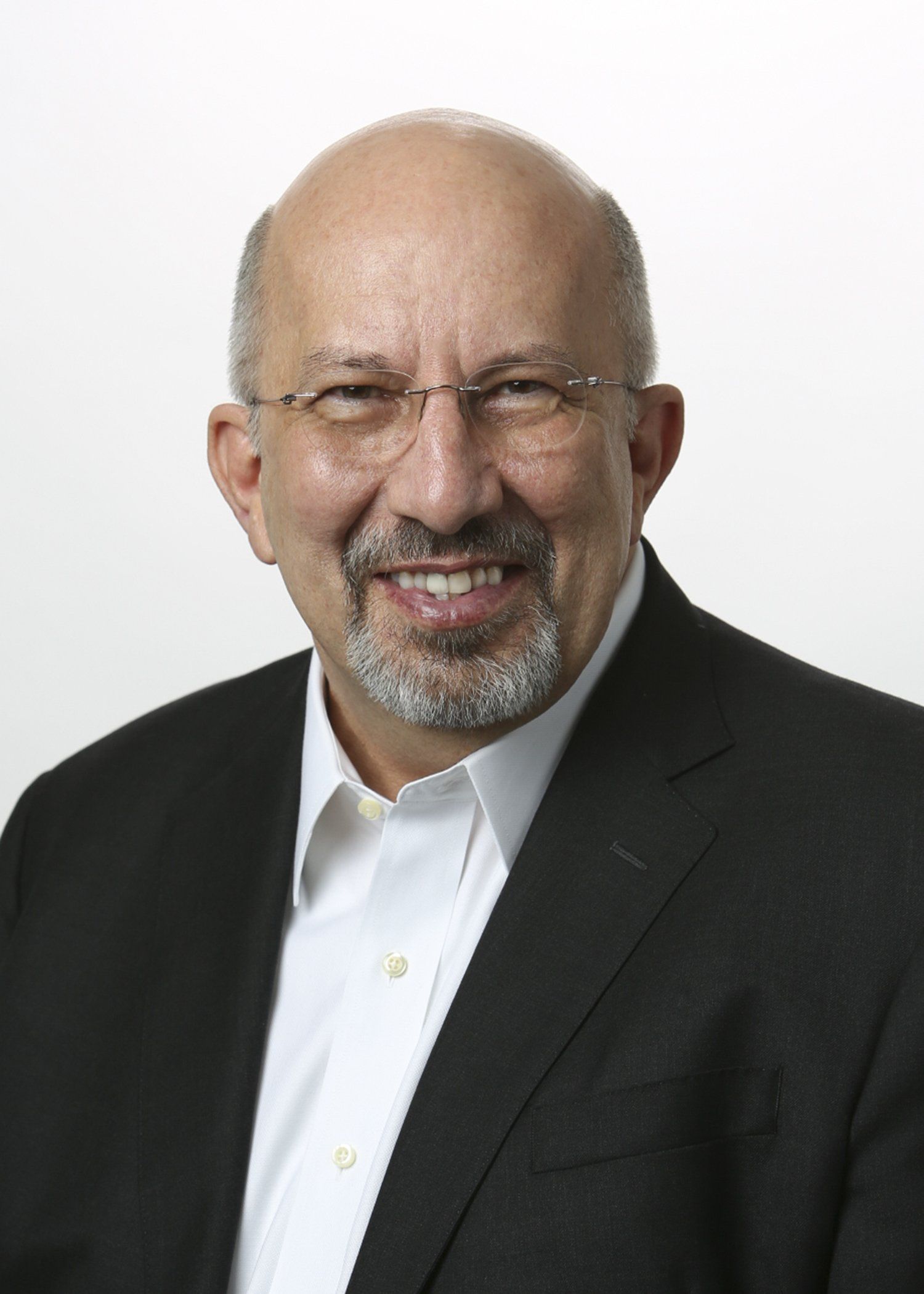 Professional headshot with white background of businessman in Nashville