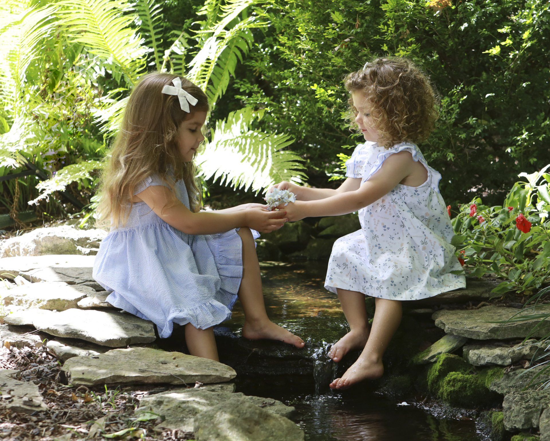 Portrait-of-sisters-playing-outdoors
