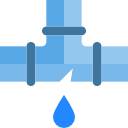 Una tubería de agua de la que sale una gota de agua.