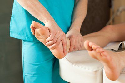 Podiatric Doctor — Massaging Foot in Pompano Beach, FL Podiatric Doctor — Massaging Foot in Pompano Beach, FL