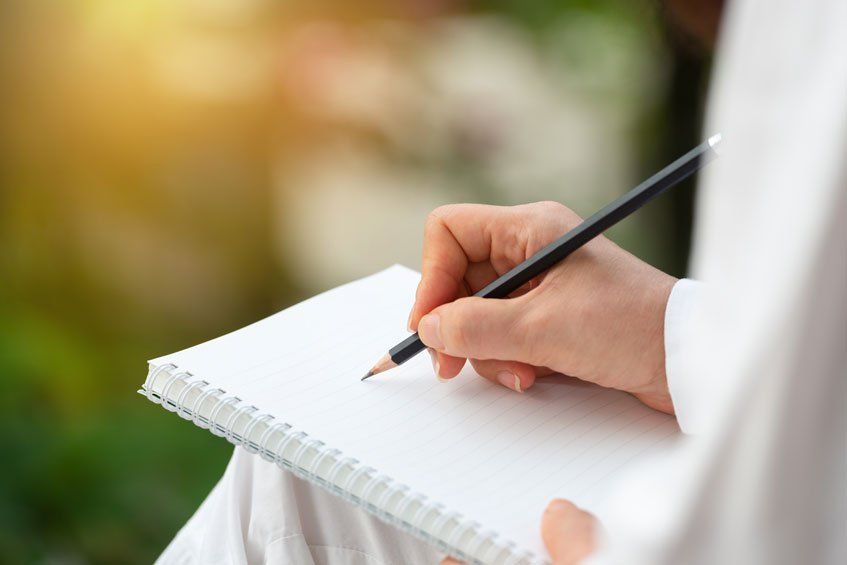 Woman Writing in a Journal 
