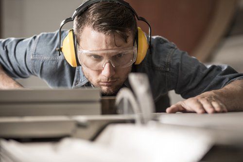 Man with Clear Glass and Yellow Headset — Travelers Rest, SC — Guy M Beaty Co Man with Clear Glass and Yellow Headset — Travelers Rest, SC — Guy M Beaty Co
