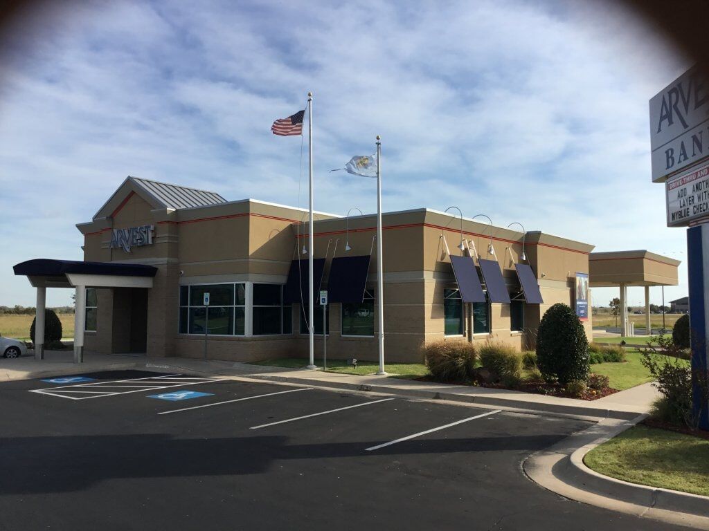 Plastering Building — Arvest Building with Flags in Oklahoma City, OK