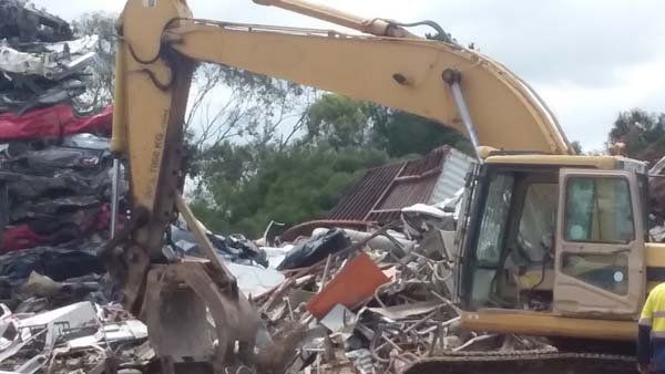 tractor moving recyclables