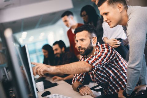 Workers Gathering in Front of a Computer — Wesley Chapel, Fl — DigitalBrainz