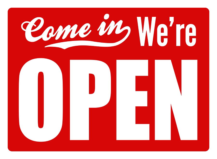 Red “Come in We’re OPEN” sign in white letters