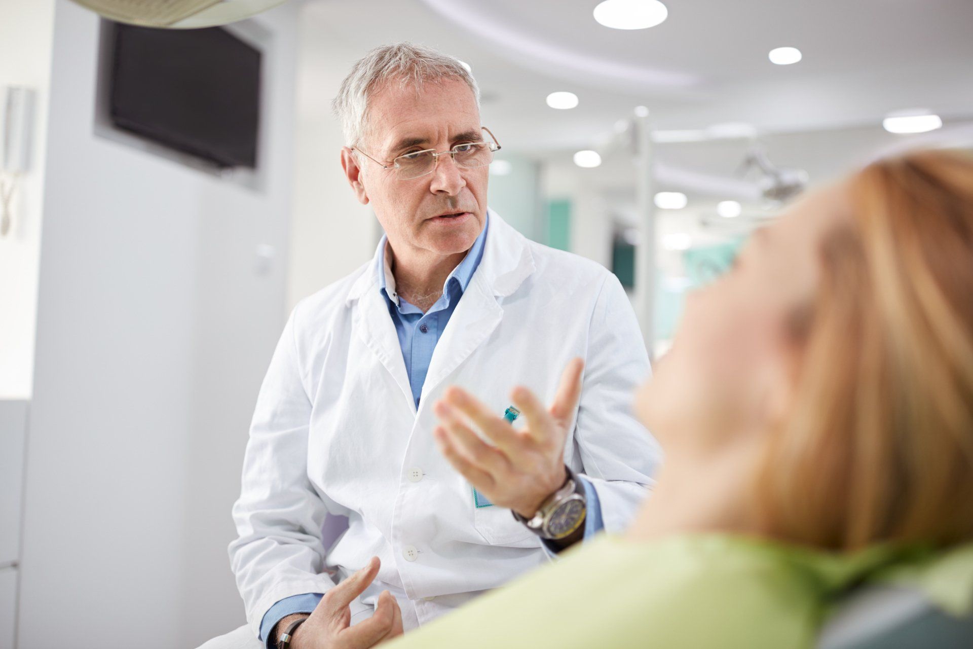 Dentist Talking to Patient