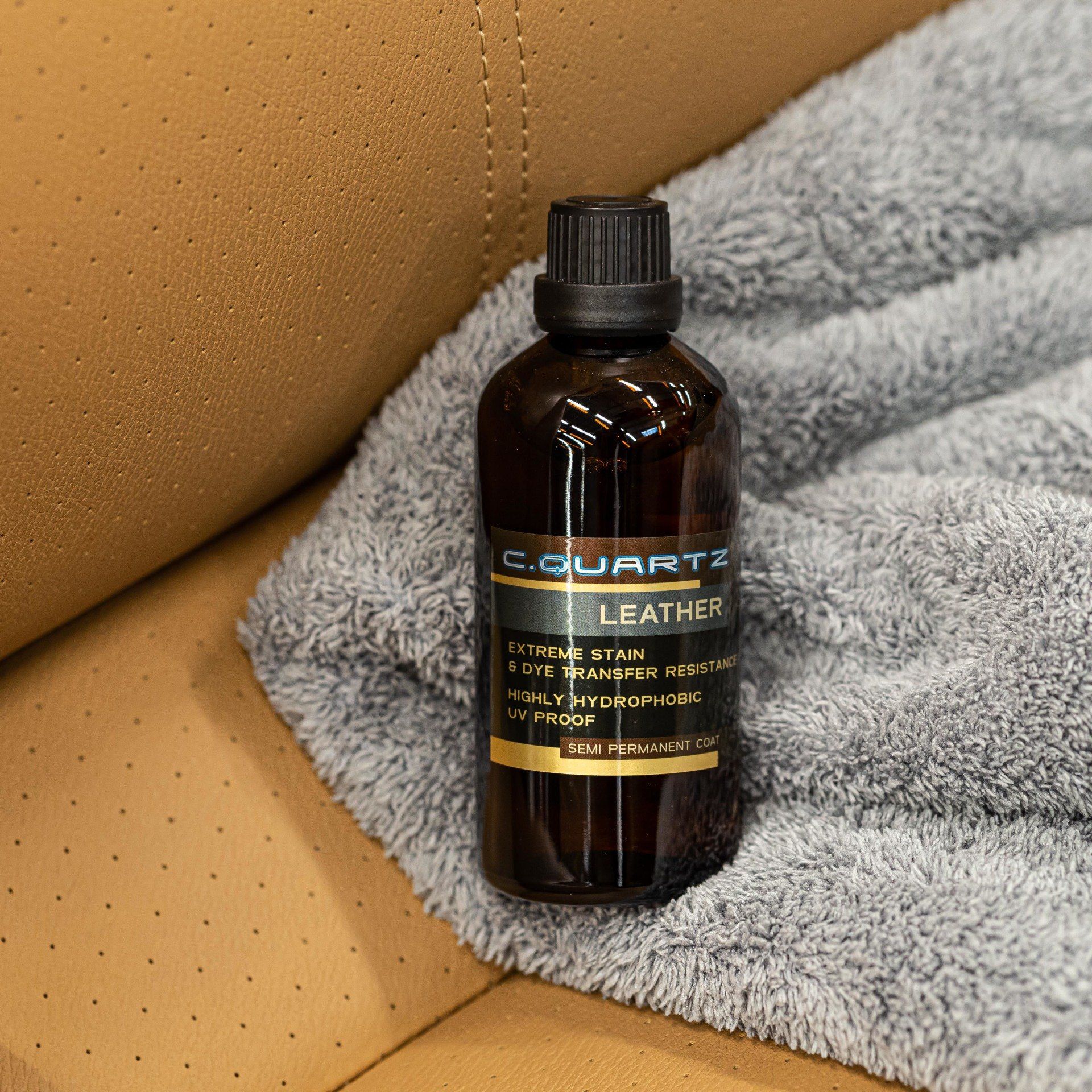 A bottle of quartz leather sitting on top of a couch