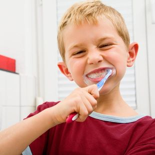 boy brushing his teeth