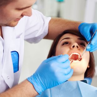 dentist working on teeth
