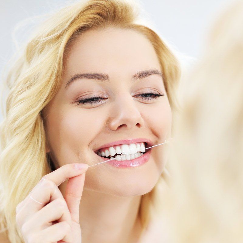 lady flossing