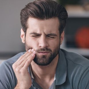 man with tooth pain