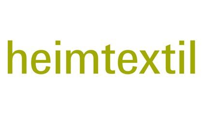 Das Logo der Heimtextil ist grün und weiß auf weißem Hintergrund.