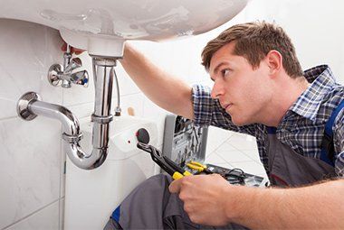 Plumber Fixing Bathroom Sink — Lafayette, LA — Colville Plumbing Plumber Fixing Bathroom Sink — Lafayette, LA — Colville Plumbing