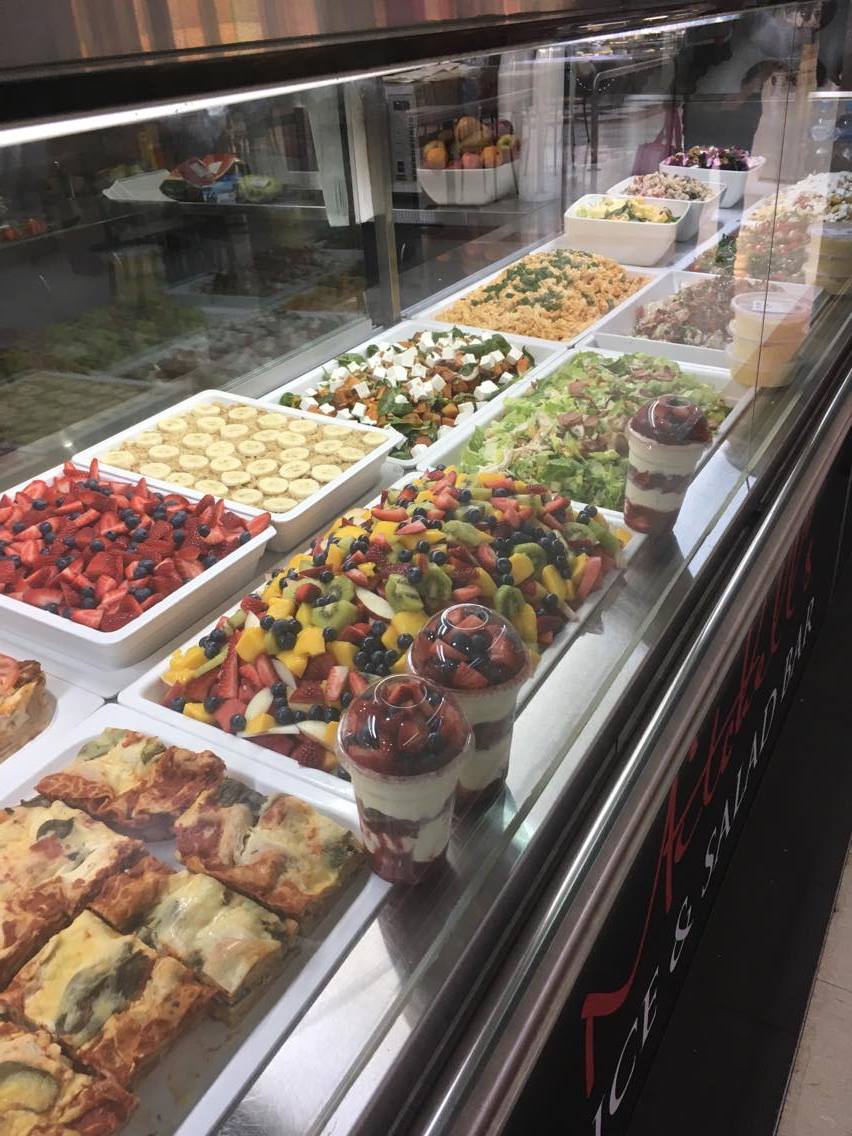 A display case filled with lots of different types of food.