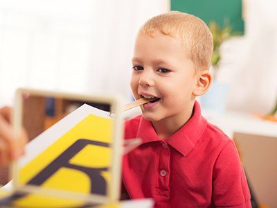 Occupational Therapy — Speech therapist Teaches the Boy in Flint Township, MI Occupational Therapy — Speech therapist Teaches the Boy in Flint Township, MI