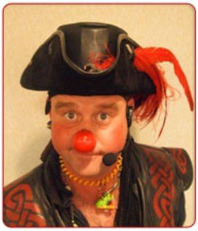 A man with a red nose wearing a pirate hat