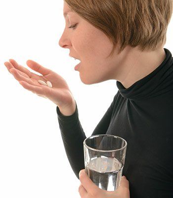 woman taking pills