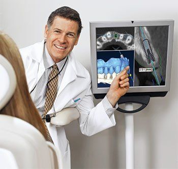 dentist showing patient xrays