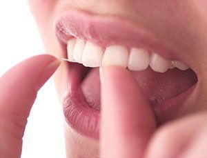 woman flossing