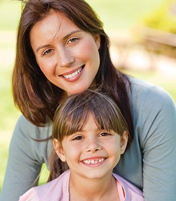 mother and daughter smiling