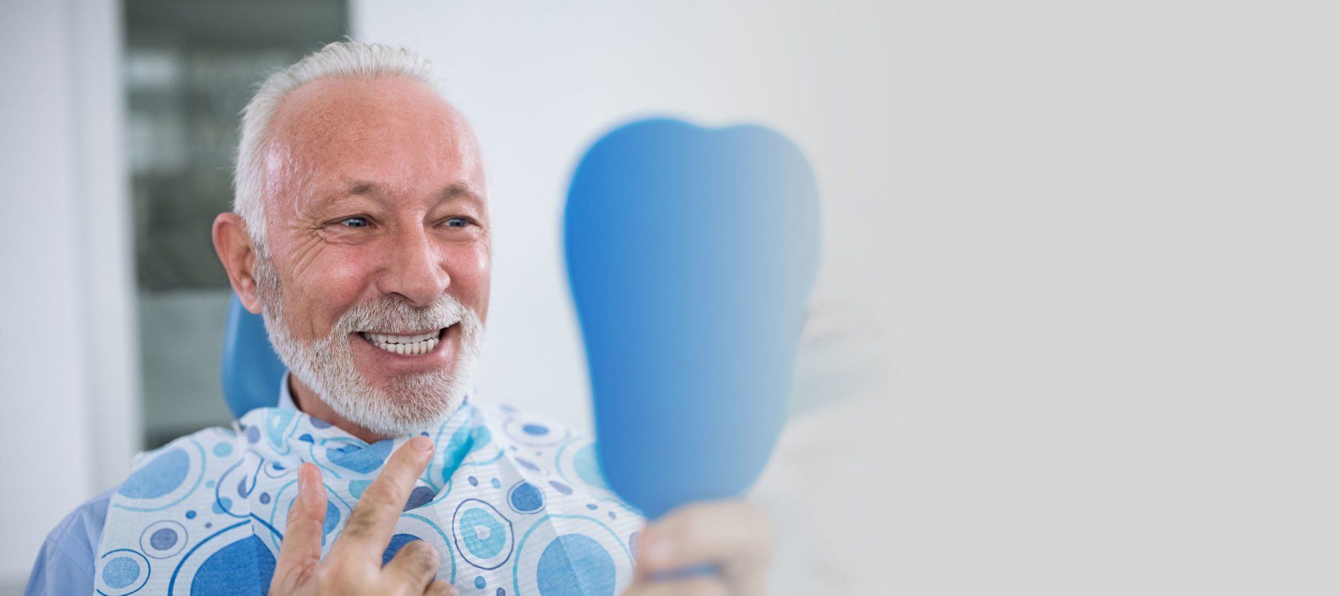elderly man receiving dental services at Sewell Dental
