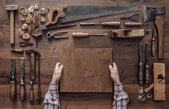 carpenter holding square wood