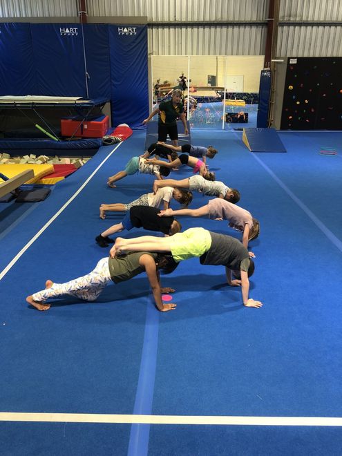 young girl trying Gymnastics