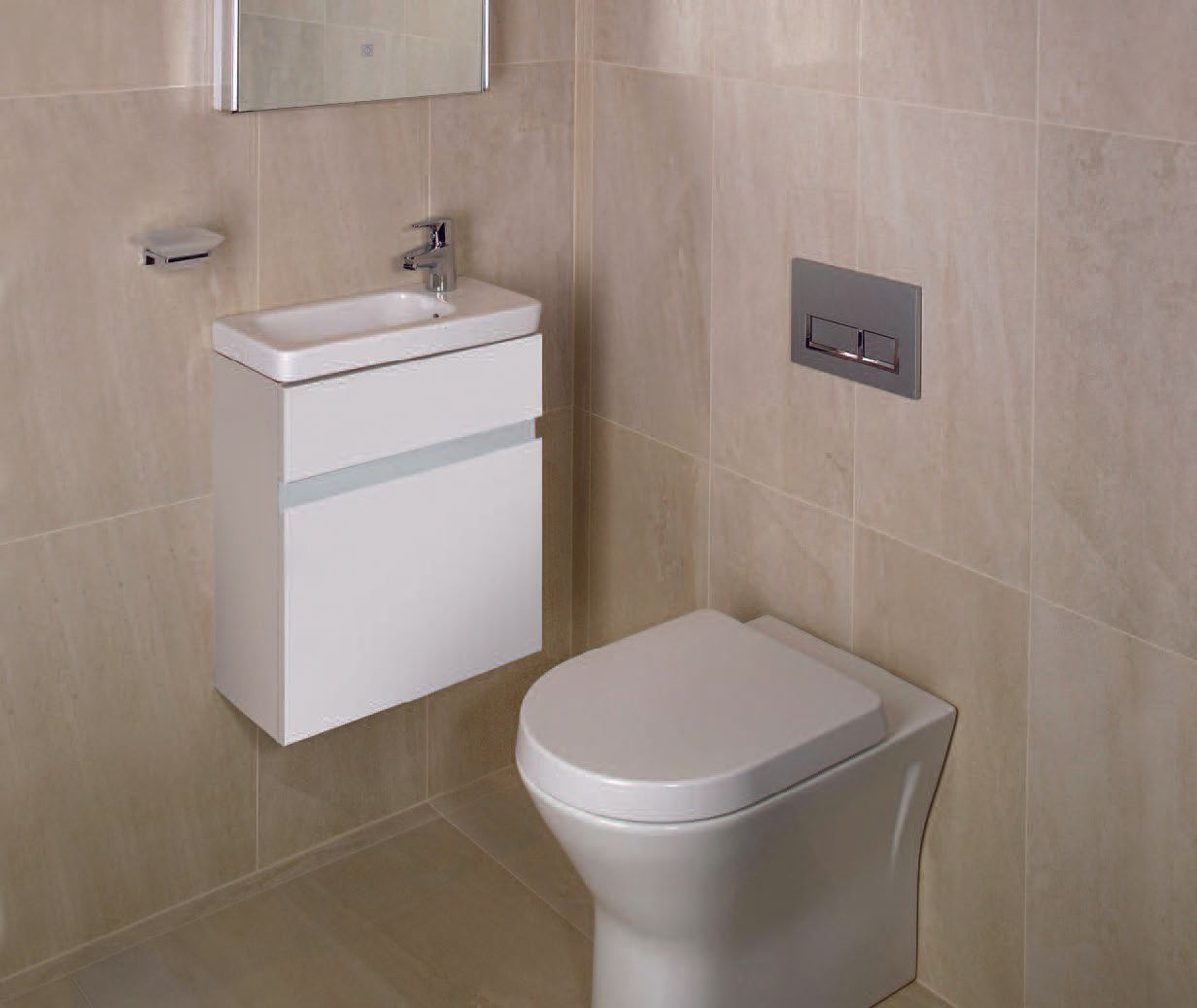Toilet and small sink in modern bathroom