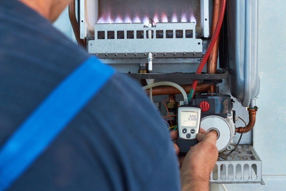Employee providing a gas service safety check
