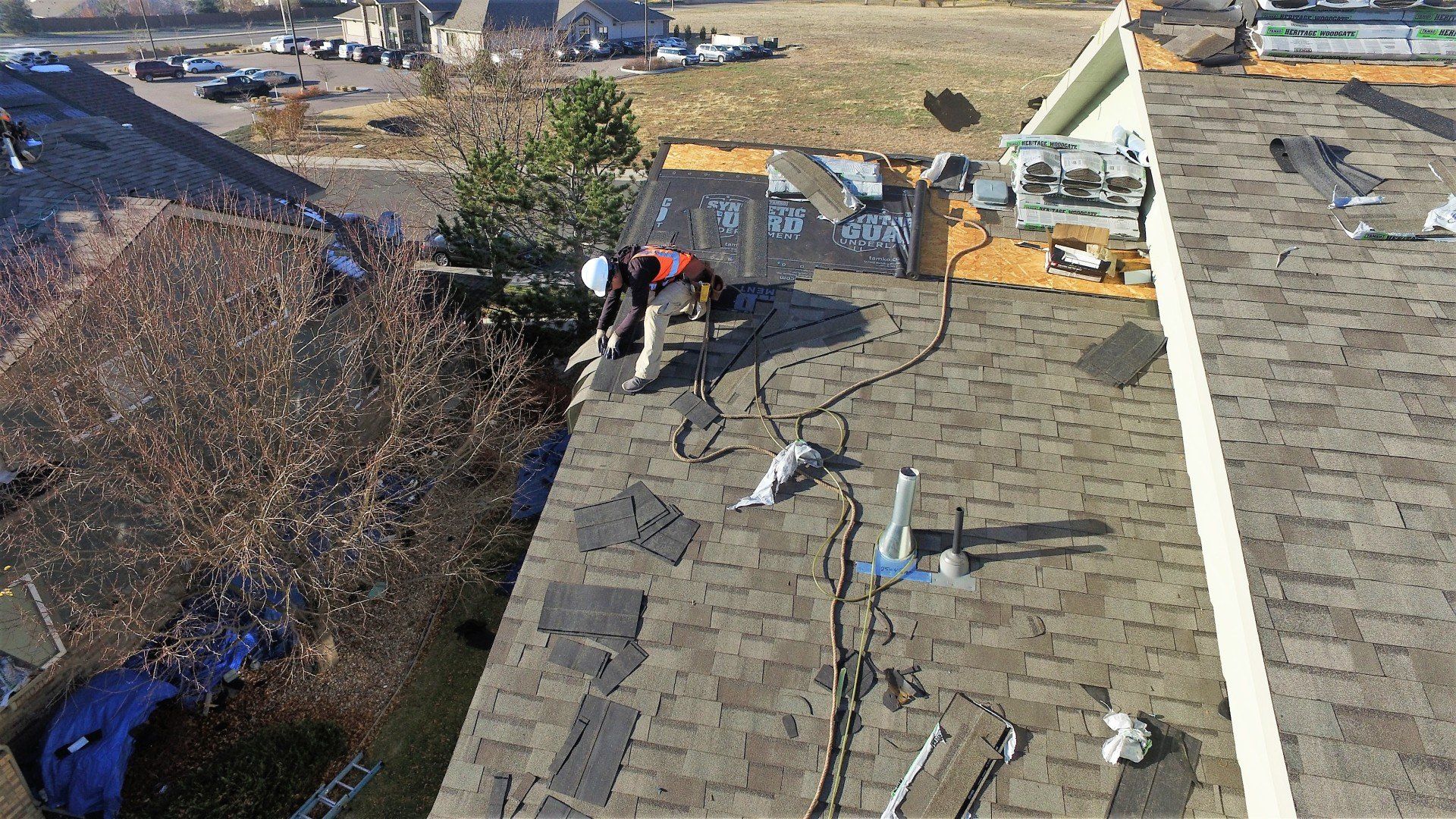 Aerial view of a new roof being installed.