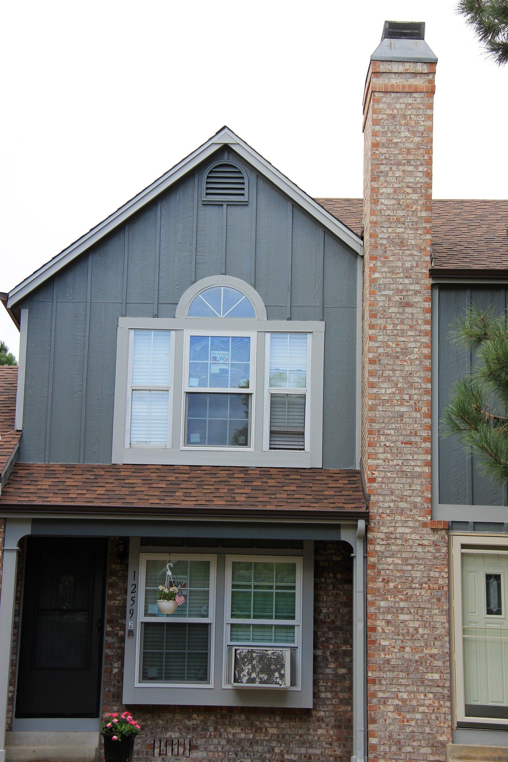 The front of a residence with new windows.