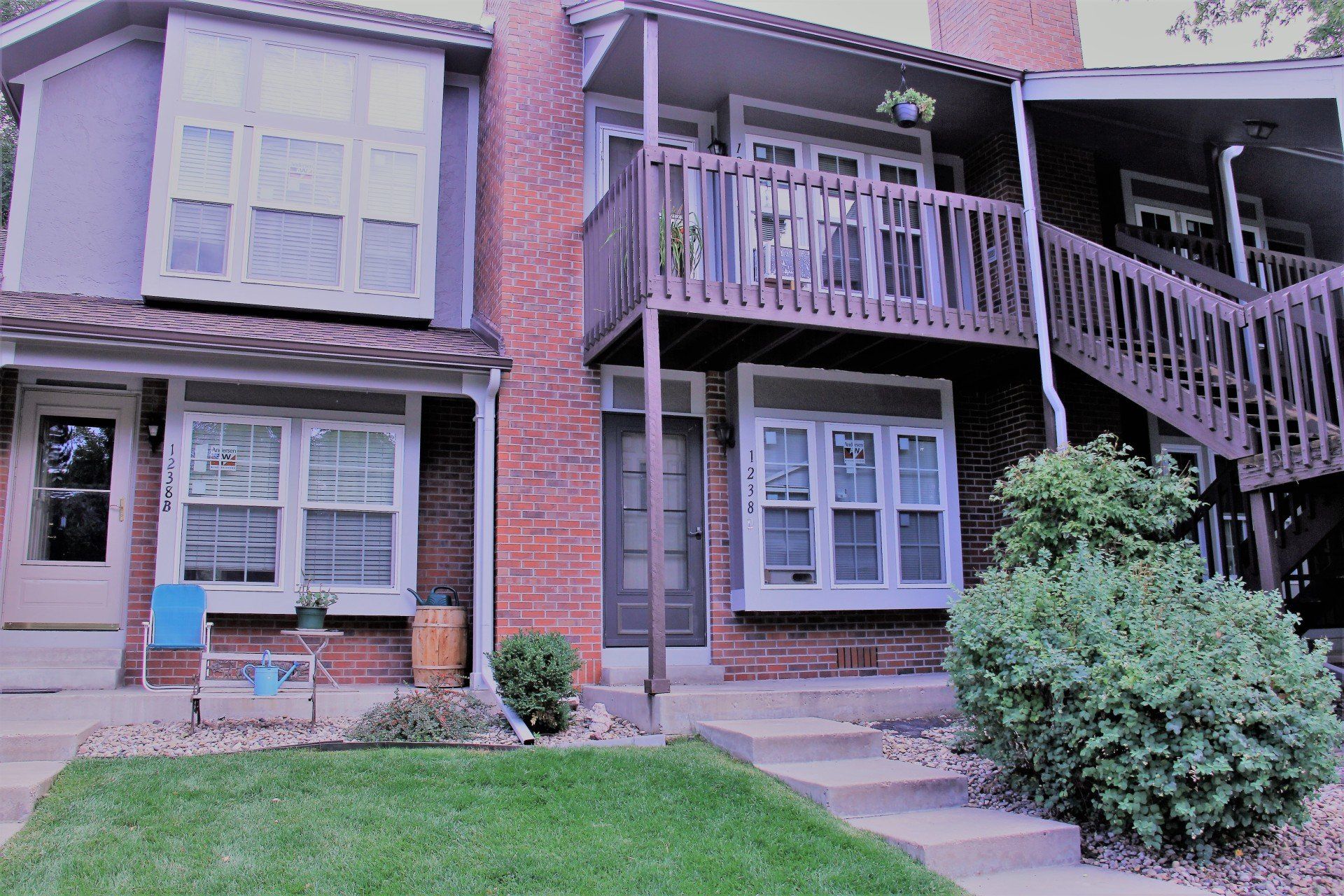 The front of multi-family two-story building with new windows.