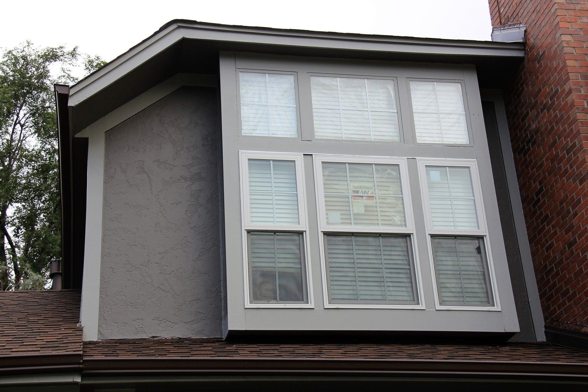 Close up of second-story windows freshly installed.