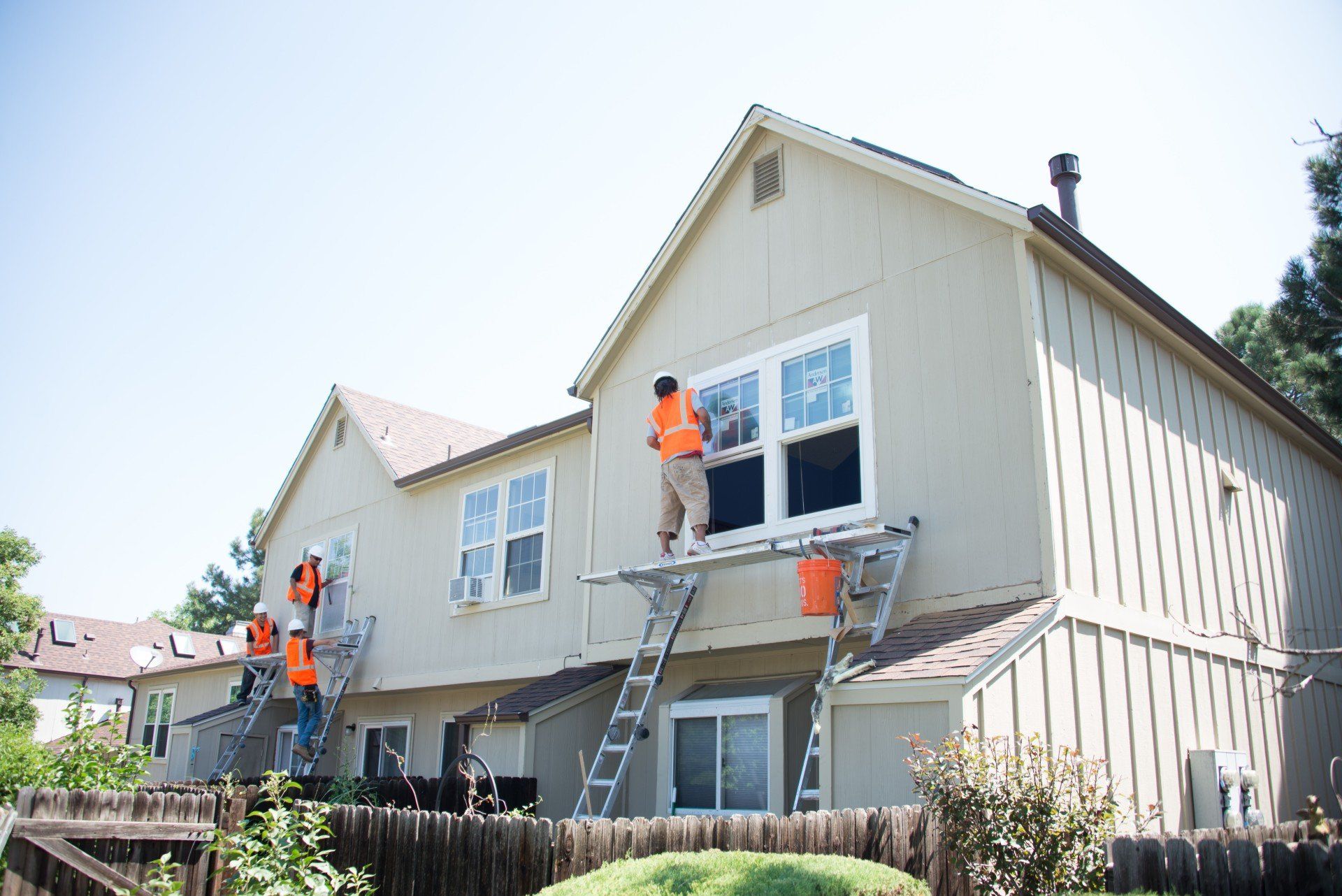 The crew is installing new Andersen windows on a multi-family property.